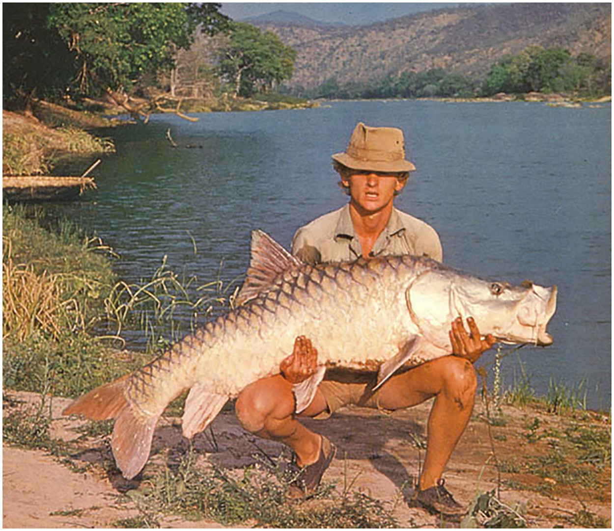 Angler with a large Hump-backed Mahseer Tor remadevii in Cauvery Wildlife Sanctuary