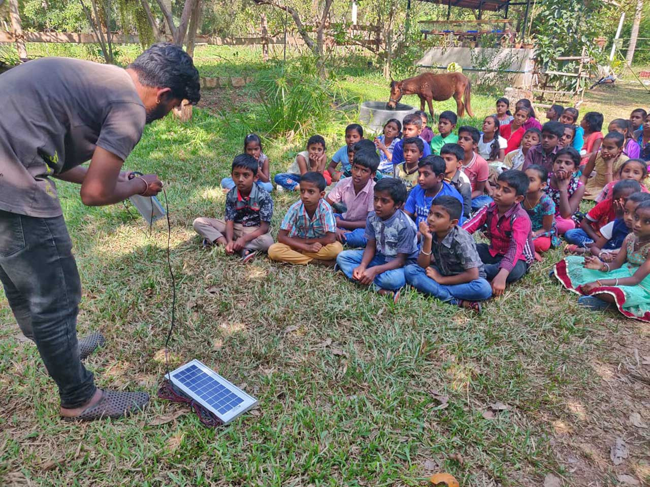 Children being trained to use solar flashlights | Nature inFocus