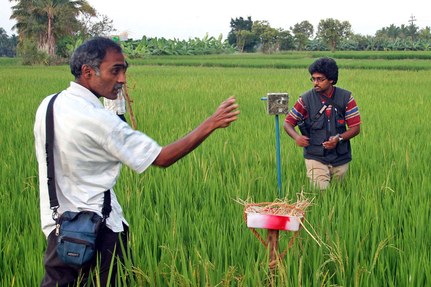 Scientists setting up camera trap