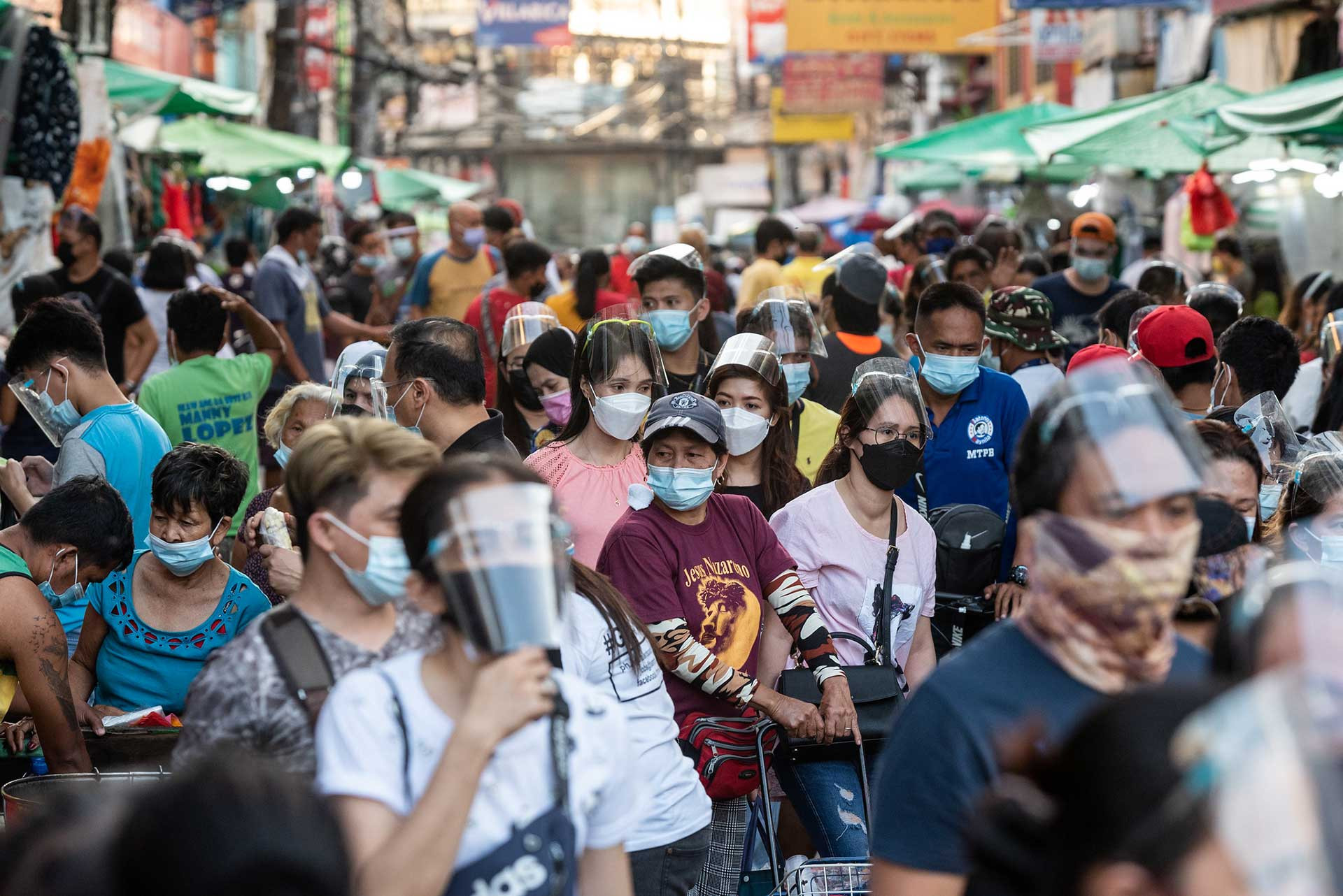 People wearing masks in a market area in Philippines
