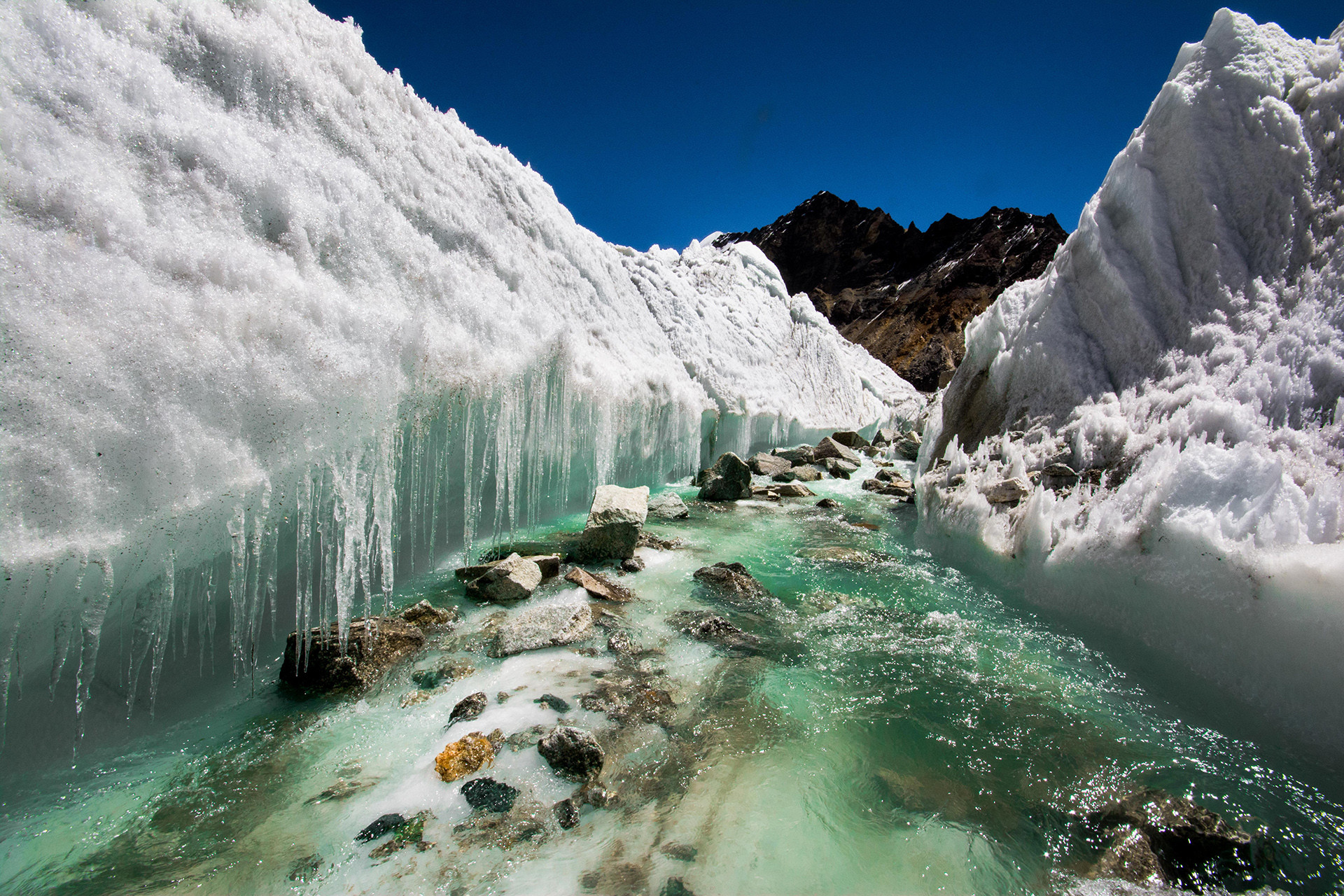 Glacial melt water carving the ice river source himalayas india - A Water Conservation Journey Spanning Valleys And Plains | Nature inFocus