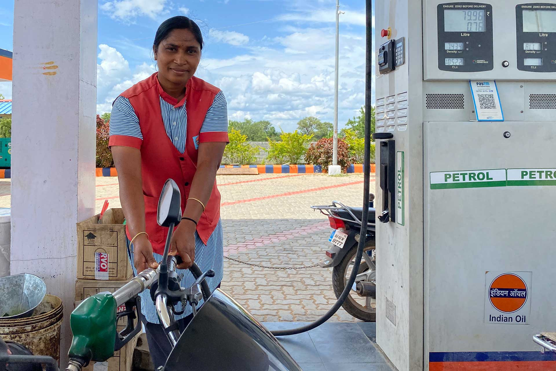 Jaya Mary, a member of the Alternate Livelihoods Program, works at a local petrol station