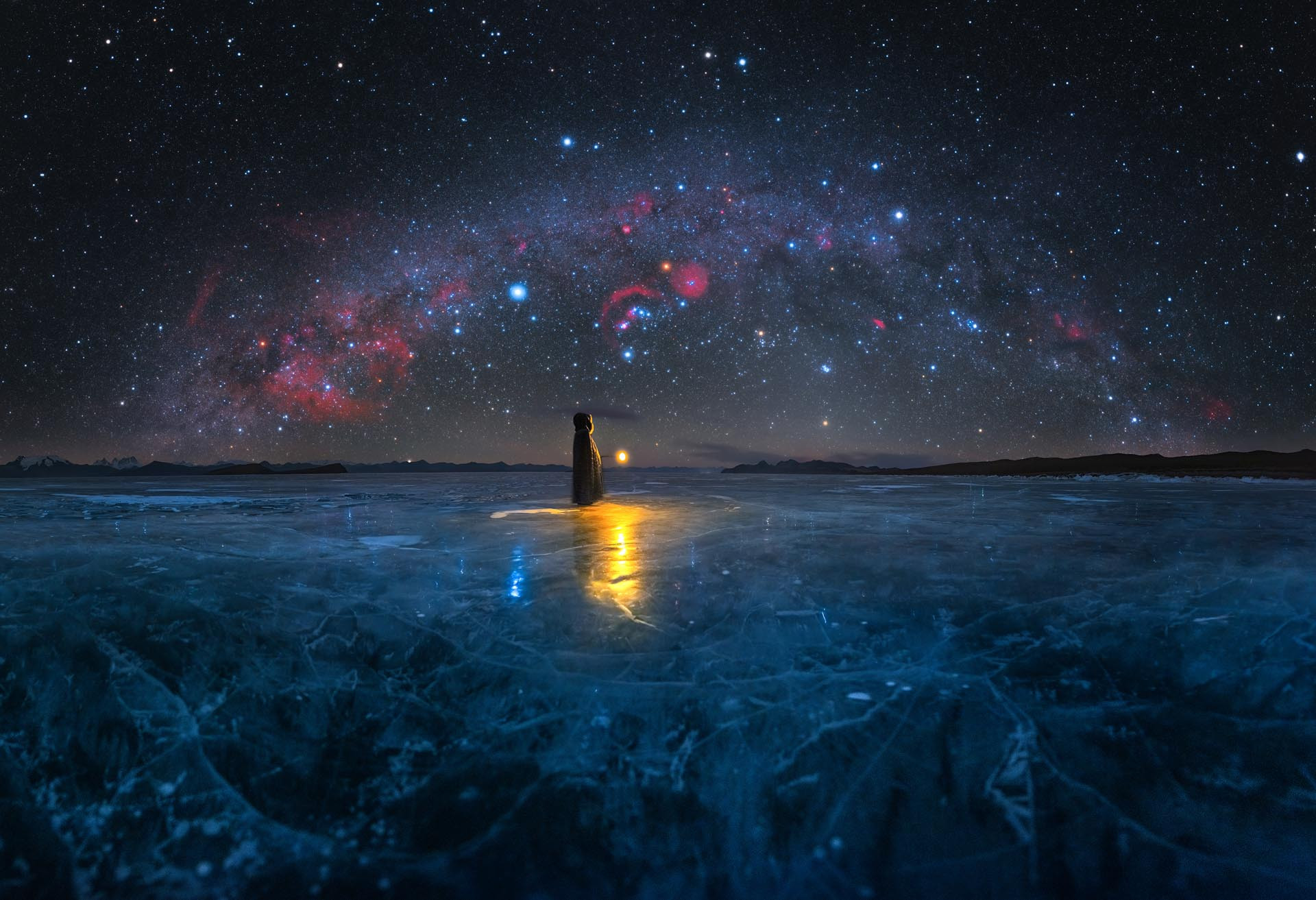 Milky way on the frozen lake Pumoungcuo in Tibet