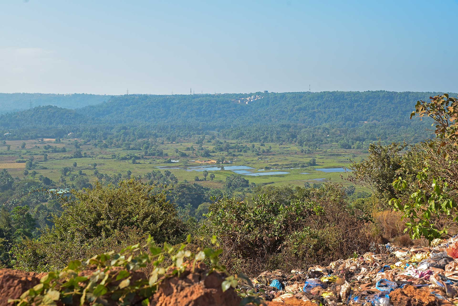 Destruction of laterite plateau by garbage dumping