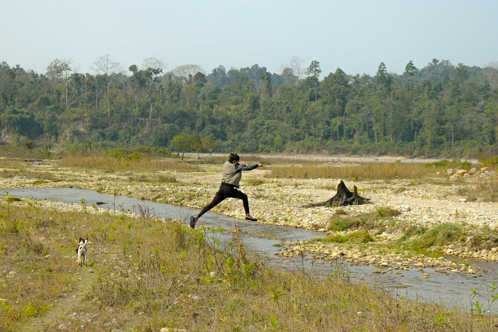 people AshokTallong jumps across small stream outside BallyVillage | Nature Infocus