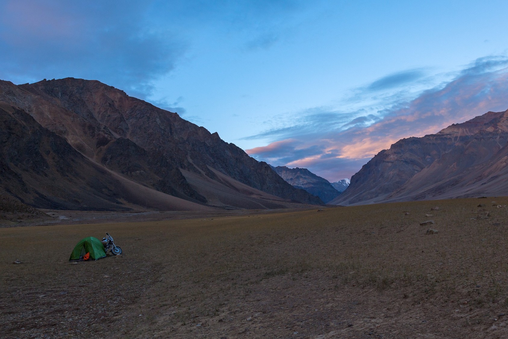 My first campsite of the trip was in Sarchu, on the Manali-Leh highway. I roamed around the windy, desolate plateau to find a good spot to pitch my tent. It was a struggle to get it right, and I began to grow frustrated. The moment I was envisioning, of starry night and golden peaks, vanished into thin air. But going solo, you don’t have anyone else to blame for the decisions you make along the way. In the morning though, the drama in the sky more than made up for it. When I unzipped my tent, I was greeted by astonishingly bright red clouds, reflected in the river below. Alas, it passed too quickly to capture on my camera.