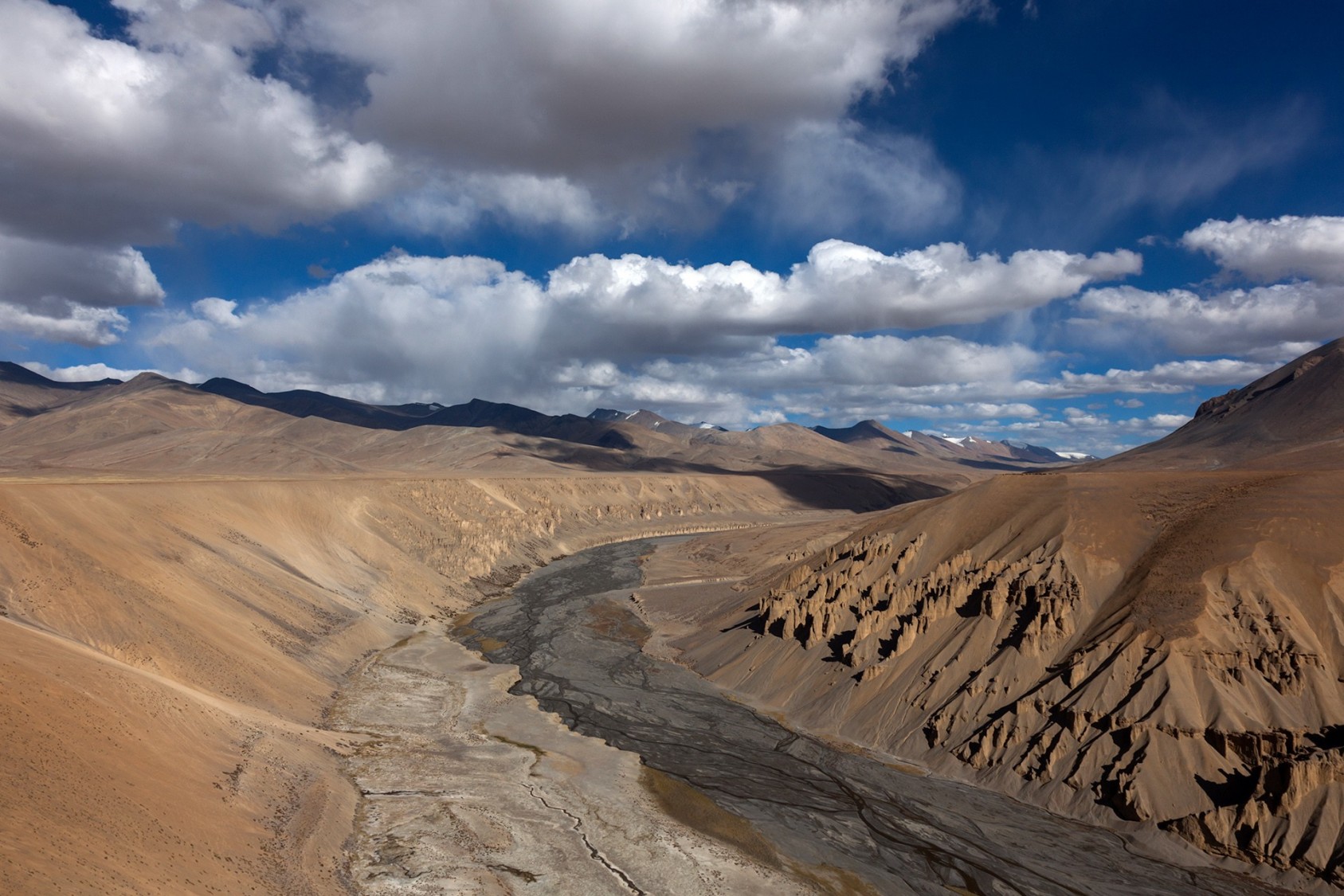 The Morey plains near Pang on the Manali-Leh highway. These geological structures are formed over years and years by the forces of wind and water. This newly laid road cuts through the plateau and is a pleasure to ride on. The landscape is deserted, aside from occasional bikers zipping through on their way back from Leh.
