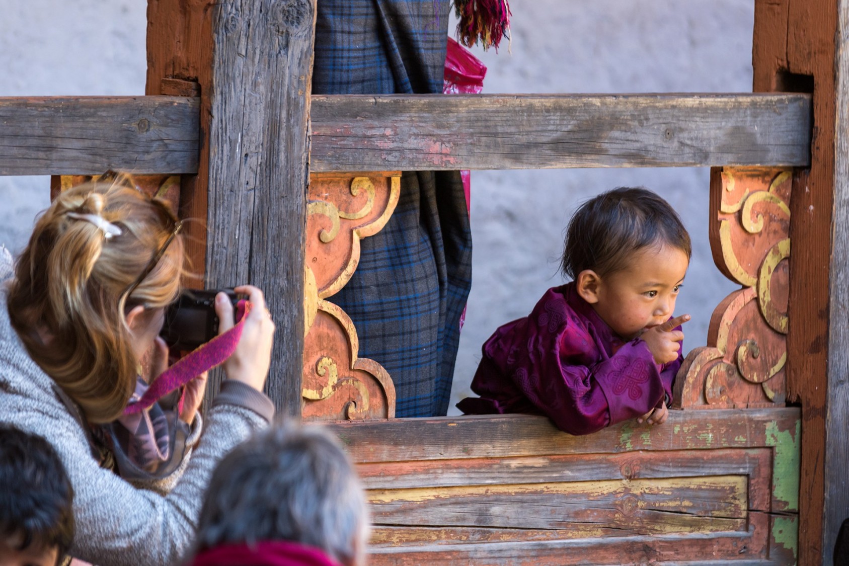 Children in their vibrant-hued traditional attire at the Tsechu festival in Bumthang, Bhutan. They would entertain tourists with their attention-grabbing antics.