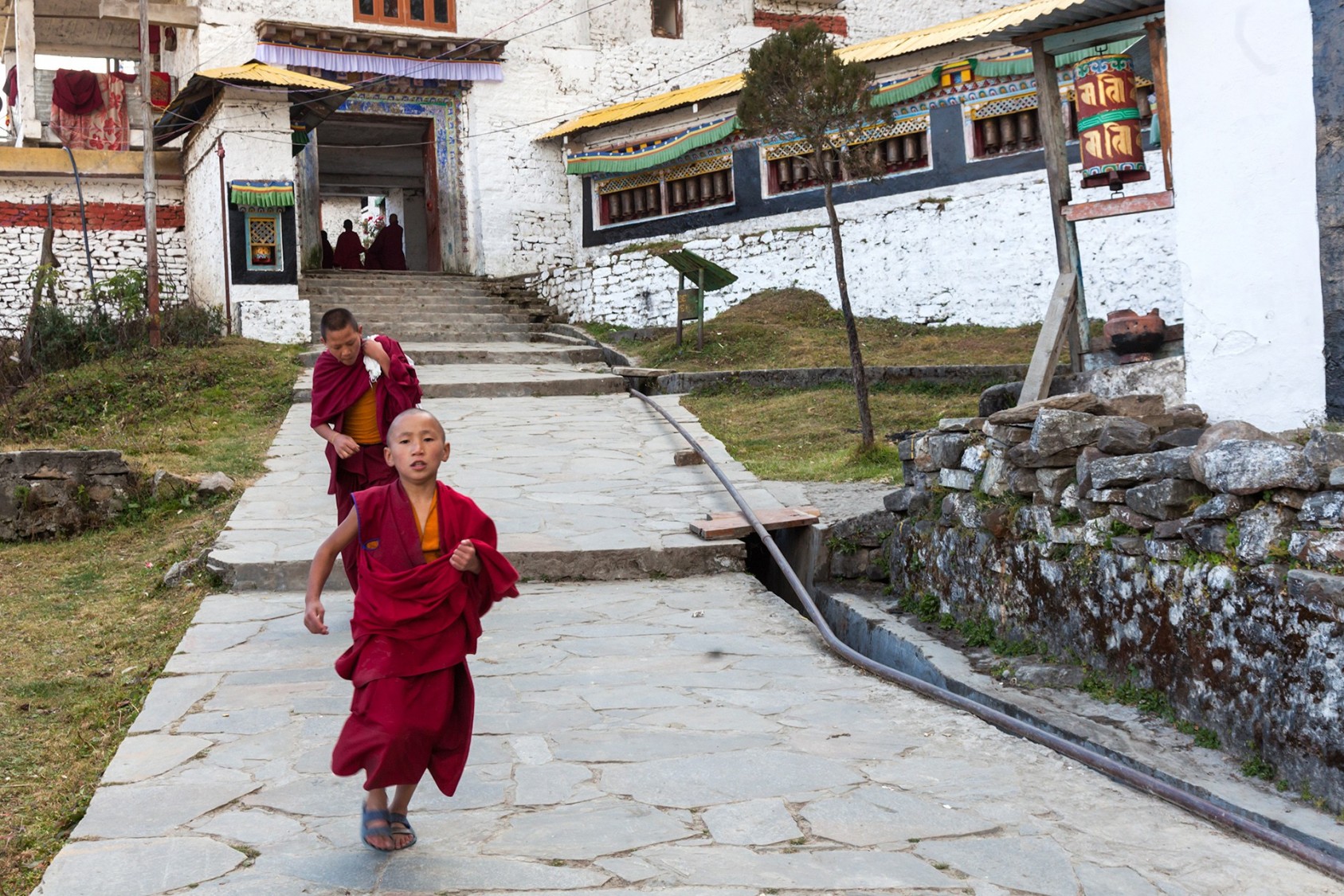 A little monk runs around in Tawang Monastery, Arunachal Pradesh.