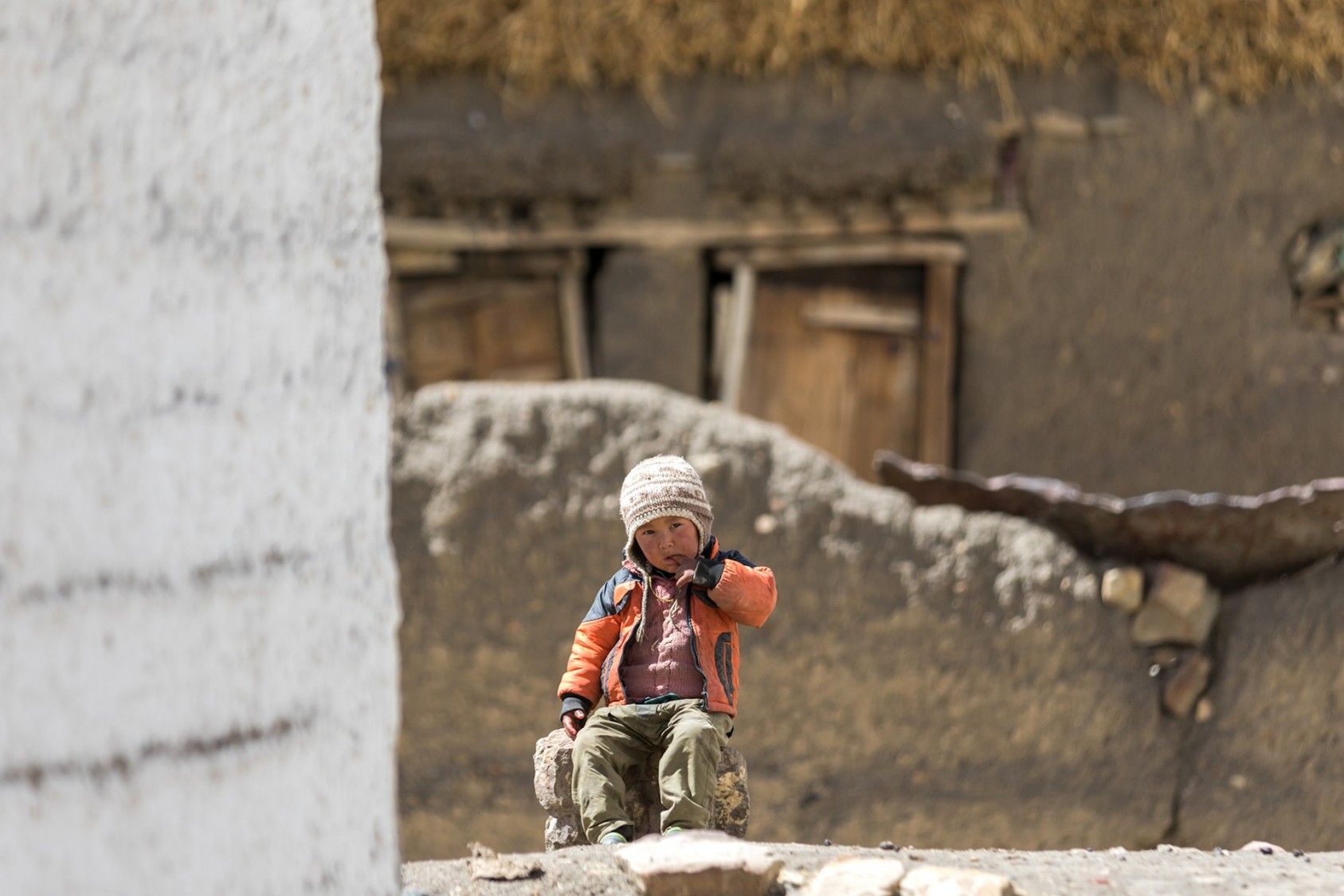 This little boy was hanging around the post office in Hikkim, Spiti Valley. He was lost in his own world, but kept an eye on me as he checked out my bike from a distance. I tried to talk to him but he was very shy. 
